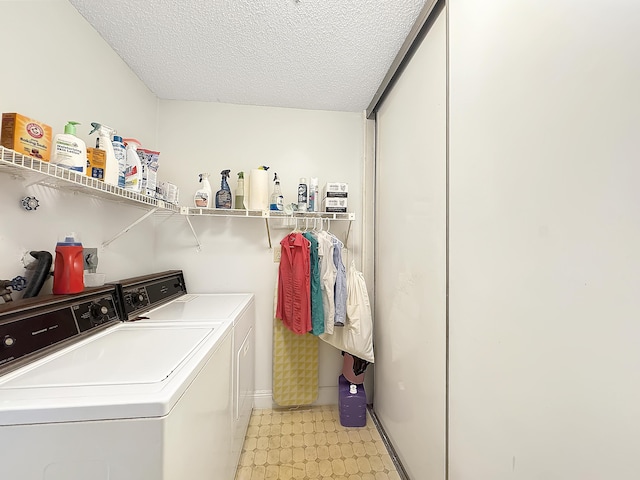 4960 E Sabal Palm Blvd Unit 206, Tamarac, FL 33319 - washroom with washer and clothes dryer, a textured ceiling, and baseboards