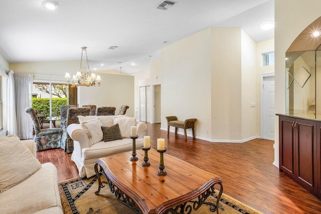 7338 Chorale Rd, Boynton Beach, FL 33437 - living area featuring a chandelier, wood finished floors, vaulted ceiling, and baseboards