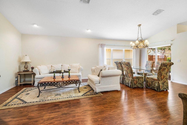 7338 Chorale Rd, Boynton Beach, FL 33437 - living room with a chandelier, dark wood finished floors, and baseboards