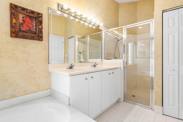 7338 Chorale Rd, Boynton Beach, FL 33437 - full bathroom featuring a stall shower, tile patterned floors, double vanity, a textured wall, and a closet