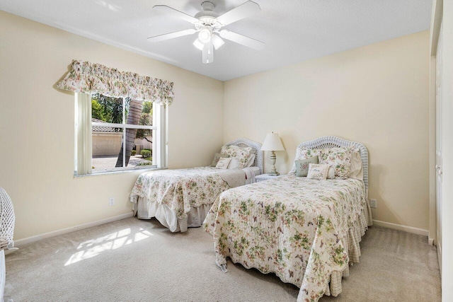 7338 Chorale Rd, Boynton Beach, FL 33437 - bedroom with light colored carpet, baseboards, and a ceiling fan