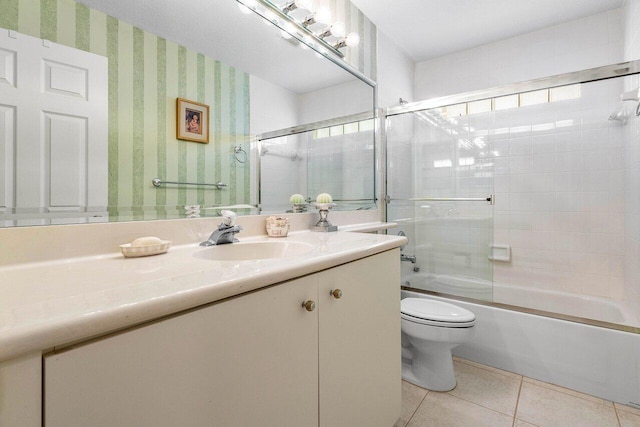 7338 Chorale Rd, Boynton Beach, FL 33437 - bathroom featuring toilet, tile patterned floors, vanity, shower / bath combination with glass door, and wallpapered walls