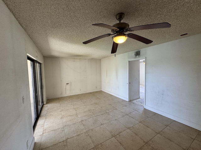 1453 Lake Crystal Dr Unit H, West Palm Beach, FL 33411 - unfurnished room featuring a ceiling fan, a textured ceiling, and baseboards