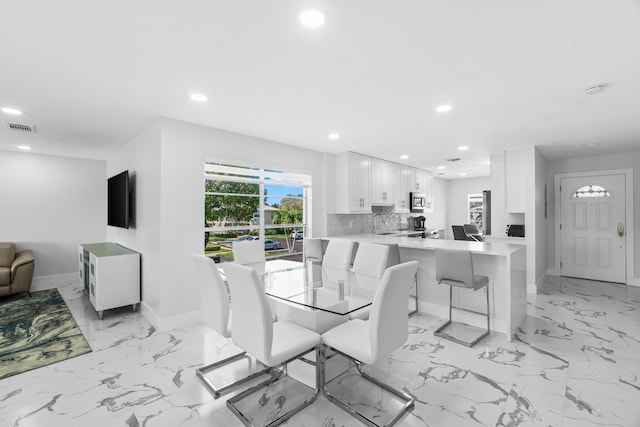 6 Stratford Dr E Unit D, Boynton Beach, FL 33436 - dining area with baseboards, recessed lighting, and light marble finish flooring