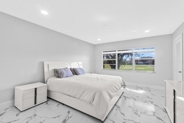 6 Stratford Dr E Unit D, Boynton Beach, FL 33436 - bedroom featuring baseboards, light marble finish floors, and recessed lighting