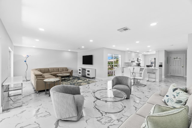 6 Stratford Dr E Unit D, Boynton Beach, FL 33436 - living room featuring recessed lighting, light marble finish flooring, and baseboards