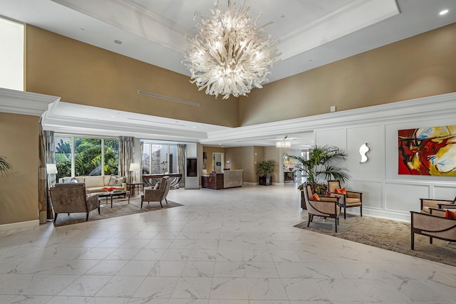 6 Stratford Dr E Unit D, Boynton Beach, FL 33436 - building lobby featuring a high ceiling, ornamental molding, recessed lighting, and a decorative wall