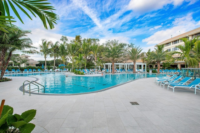 6 Stratford Dr E Unit D, Boynton Beach, FL 33436 - community pool featuring a patio area and fence