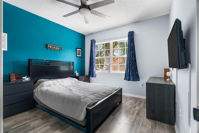 2879 Crestwood Ter Unit 1202, Margate, FL 33063 - bedroom featuring wood finished floors, a textured ceiling, ceiling fan, and baseboards
