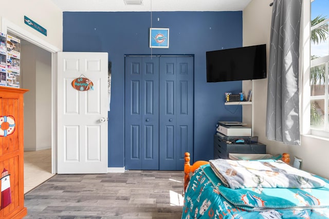 2879 Crestwood Ter Unit 1202, Margate, FL 33063 - bedroom featuring a closet and wood finished floors
