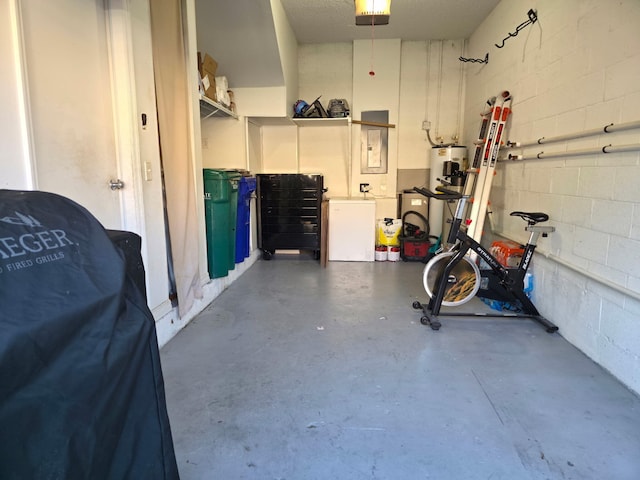 2879 Crestwood Ter Unit 1202, Margate, FL 33063 - garage featuring a garage door opener, water heater, concrete block wall, and fridge