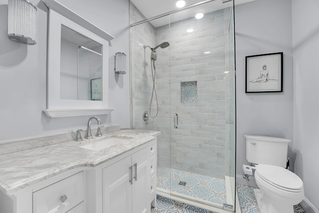 1511 S Palmway, Lake Worth Beach, FL 33460 - bathroom with a stall shower, toilet, tile patterned floors, vanity, and baseboards