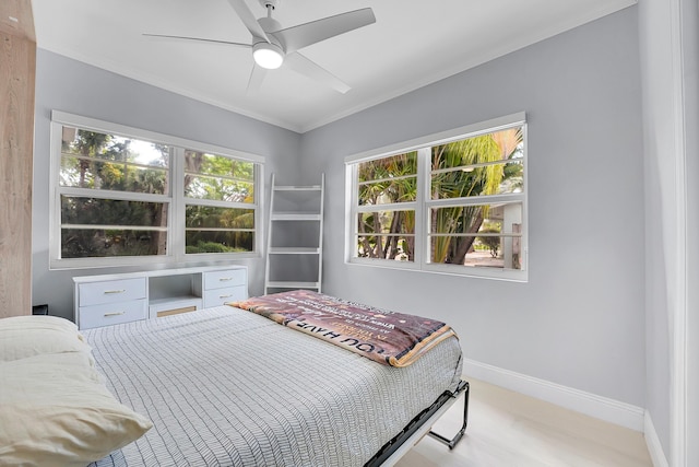 1511 S Palmway, Lake Worth Beach, FL 33460 - bedroom with wood finished floors, baseboards, ornamental molding, and ceiling fan