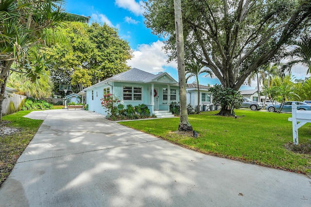 1511 S Palmway, Lake Worth Beach, FL 33460 - view of front facade with stucco siding and concrete driveway
