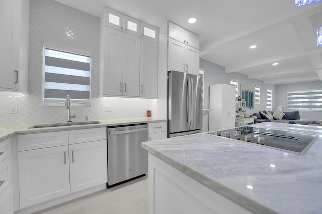 1511 S Palmway, Lake Worth Beach, FL 33460 - kitchen with appliances with stainless steel finishes, a sink, recessed lighting, white cabinetry, and tasteful backsplash