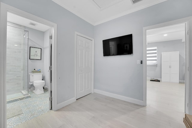 1511 S Palmway, Lake Worth Beach, FL 33460 - unfurnished bedroom with light wood-style flooring, ornamental molding, connected bathroom, a closet, and baseboards