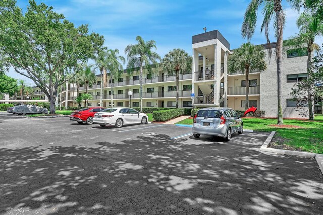 15244 Lakes Of Delray Blvd Unit 112, Delray Beach, FL 33484 - view of uncovered parking lot