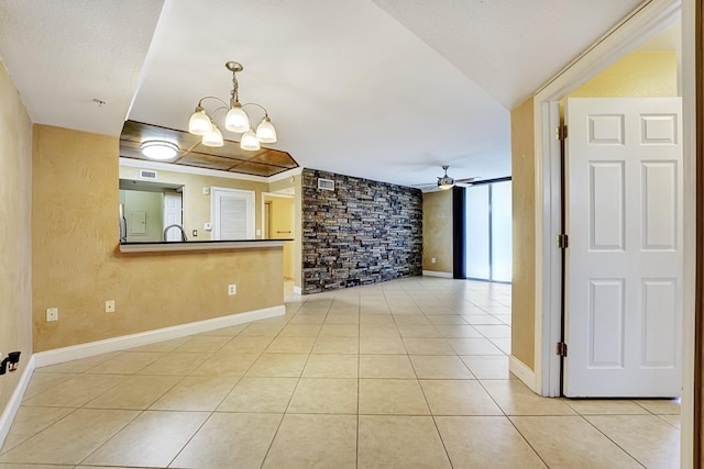 15035 Michelangelo Blvd Unit 106, Delray Beach, FL 33446 - spare room featuring light tile patterned floors, a chandelier, a ceiling fan, and baseboards
