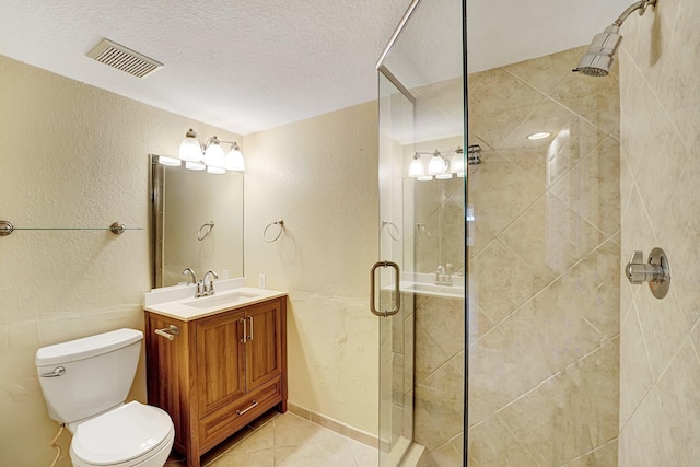 15035 Michelangelo Blvd Unit 106, Delray Beach, FL 33446 - bathroom featuring vanity, a shower stall, tile patterned flooring, toilet, and a textured wall
