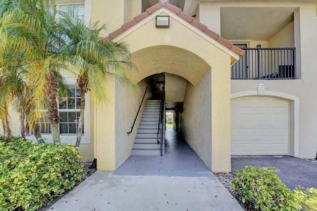 15035 Michelangelo Blvd Unit 106, Delray Beach, FL 33446 - view of exterior entry featuring stucco siding
