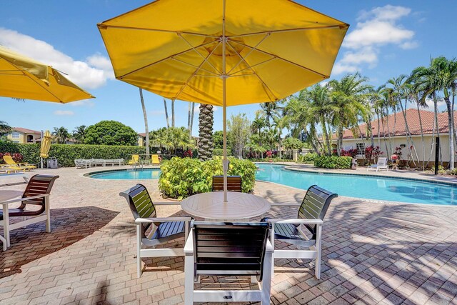 15035 Michelangelo Blvd Unit 106, Delray Beach, FL 33446 - community pool with a patio area