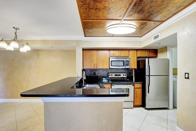 15035 Michelangelo Blvd Unit 106, Delray Beach, FL 33446 - kitchen featuring appliances with stainless steel finishes, a sink, light tile patterned floors, ornamental molding, and tasteful backsplash