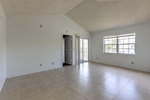 1604 SE Green Acres Cir Unit T201, Port Saint Lucie, FL 34952 - unfurnished room with a textured ceiling, light tile patterned floors, and high vaulted ceiling