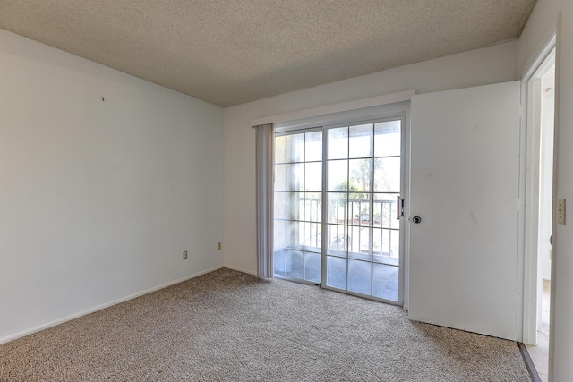 1604 SE Green Acres Cir Unit T201, Port Saint Lucie, FL 34952 - carpeted spare room featuring a textured ceiling and baseboards