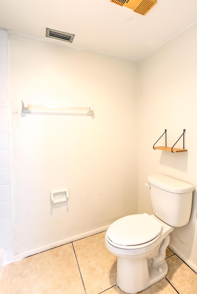 1604 SE Green Acres Cir Unit T201, Port Saint Lucie, FL 34952 - bathroom with toilet, tile patterned flooring, and baseboards