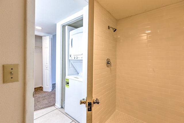 1604 SE Green Acres Cir Unit T201, Port Saint Lucie, FL 34952 - full bathroom with stacked washer and clothes dryer, a tile shower, and tile patterned flooring