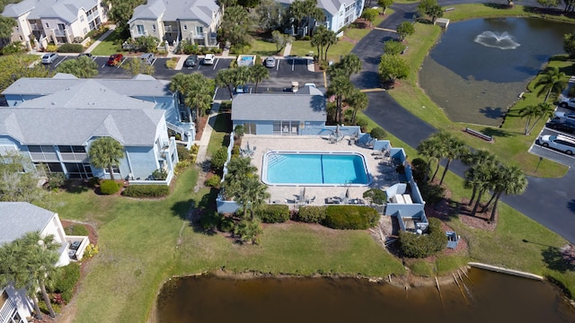 1604 SE Green Acres Cir Unit T201, Port Saint Lucie, FL 34952 - aerial view of property's location featuring nearby suburban area, a pool, and a large body of water