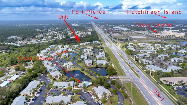 1604 SE Green Acres Cir Unit T201, Port Saint Lucie, FL 34952 - aerial overview of property's location with a major roadway, a nearby body of water, and nearby suburban area