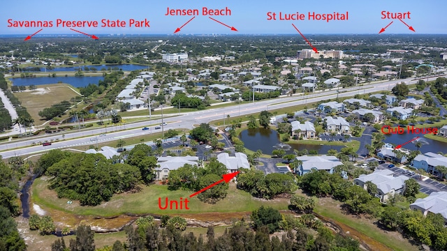 1604 SE Green Acres Cir Unit T201, Port Saint Lucie, FL 34952 - aerial view of property and surrounding area featuring a nearby body of water and nearby suburban area