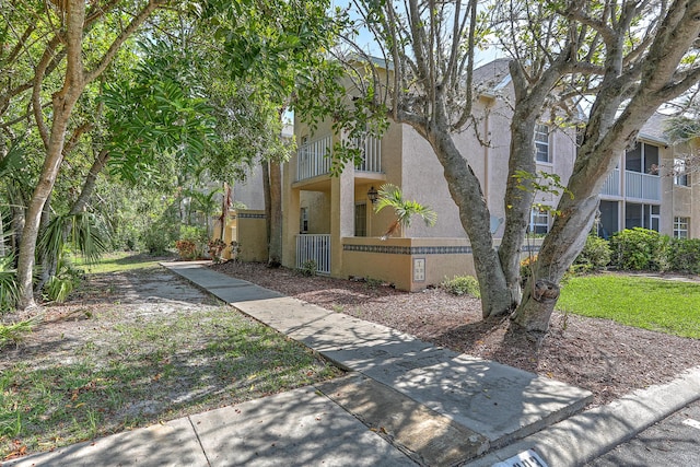 1604 SE Green Acres Cir Unit T201, Port Saint Lucie, FL 34952 - multi unit property with stucco siding and a fenced front yard