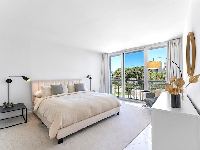 2780 S Ocean Blvd Unit 311, Palm Beach, FL 33480 - bedroom featuring a wall of windows, access to outside, and light tile patterned floors