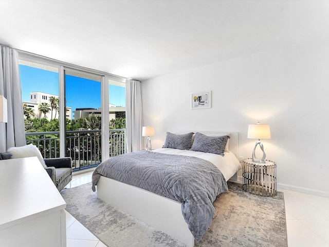 2780 S Ocean Blvd Unit 311, Palm Beach, FL 33480 - bedroom featuring light tile patterned flooring, expansive windows, access to exterior, and baseboards