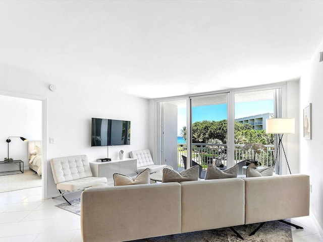 2780 S Ocean Blvd Unit 311, Palm Beach, FL 33480 - living area featuring a wall of windows and light tile patterned flooring