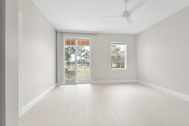 122 Ashley Ct, Jupiter, FL 33458 - empty room featuring light wood-style floors, a ceiling fan, and baseboards