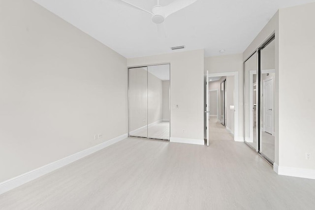 122 Ashley Ct, Jupiter, FL 33458 - unfurnished bedroom featuring light wood-style floors, baseboards, and a ceiling fan