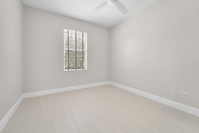 122 Ashley Ct, Jupiter, FL 33458 - spare room with light wood-style floors, a ceiling fan, and baseboards
