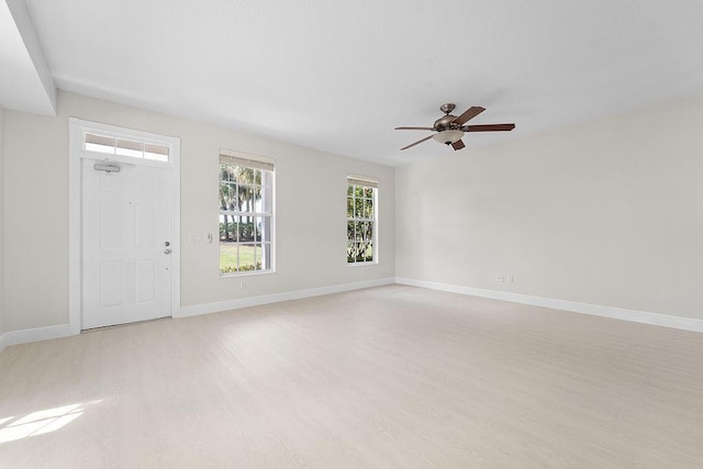 122 Ashley Ct, Jupiter, FL 33458 - spare room with light wood-style floors, a ceiling fan, and baseboards