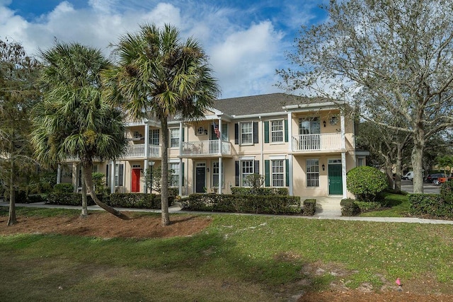 122 Ashley Ct, Jupiter, FL 33458 - multi unit property featuring a balcony, a front lawn, and stucco siding