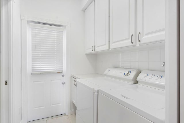 122 Ashley Ct, Jupiter, FL 33458 - laundry area with cabinet space, separate washer and dryer, and light tile patterned flooring