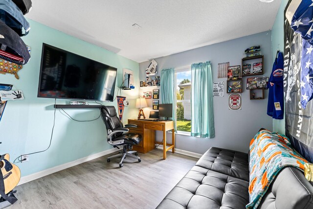 2389 SW Caballero St, Port Saint Lucie, FL 34953 - office area featuring wood finished floors and baseboards