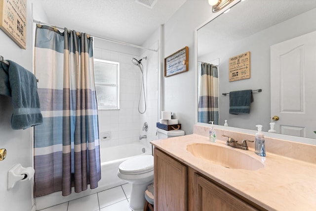 2389 SW Caballero St, Port Saint Lucie, FL 34953 - full bath with tile patterned floors, toilet, vanity, shower / bath combination with curtain, and a textured ceiling