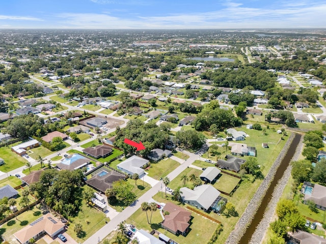 2389 SW Caballero St, Port Saint Lucie, FL 34953 - aerial overview of property's location with nearby suburban area