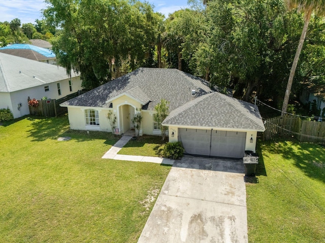 2389 SW Caballero St, Port Saint Lucie, FL 34953 - single story home featuring a garage, roof with shingles, driveway, and stucco siding
