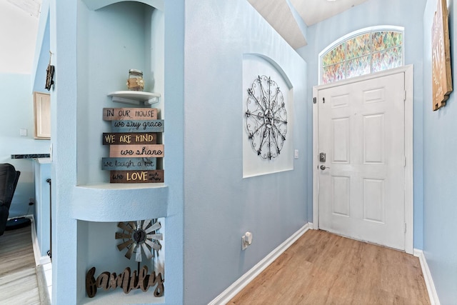 2389 SW Caballero St, Port Saint Lucie, FL 34953 - foyer entrance with light wood finished floors and baseboards