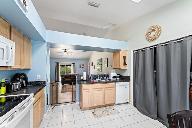 2389 SW Caballero St, Port Saint Lucie, FL 34953 - kitchen with white appliances, a peninsula, a ceiling fan, and dark countertops