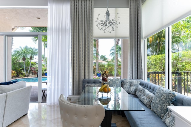 157 Esperanza Way, Palm Beach Gardens, FL 33418 - living room with a chandelier and plenty of natural light
